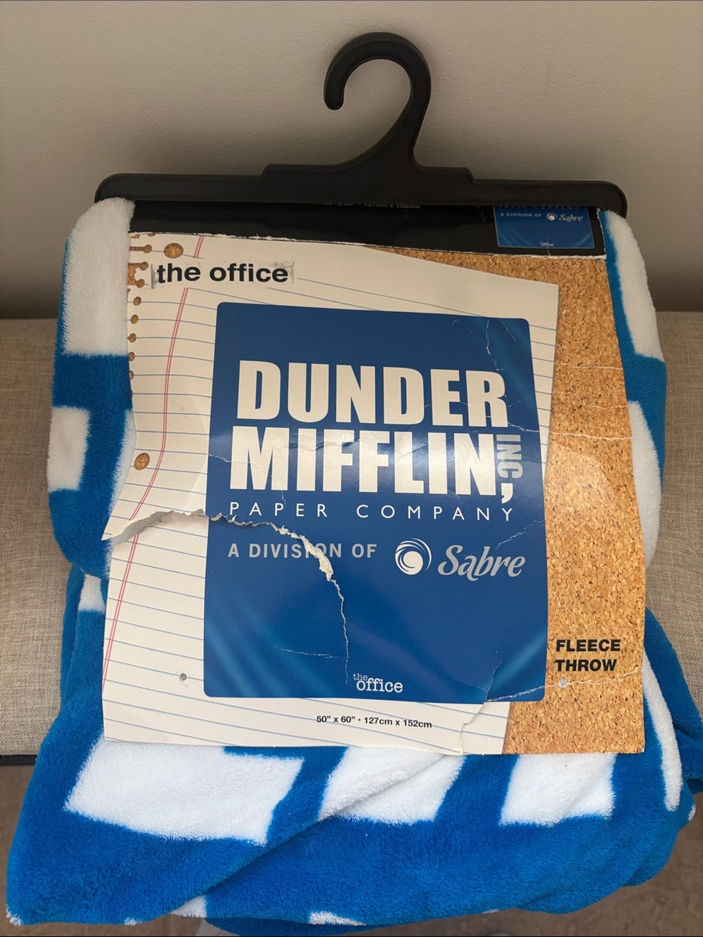 Spencer's -The Office
Dunder Mifflin Blue and White Fleece Throw